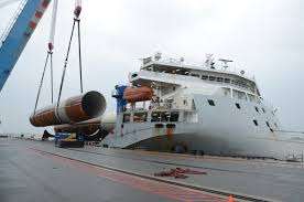 monopiles being loaded onto ship